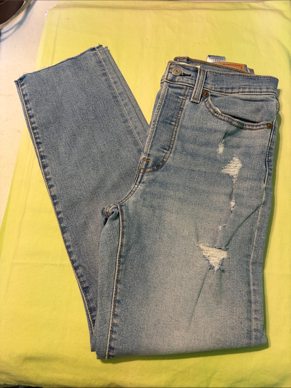Levi’sLight Wash Distressed Women’s Jeans